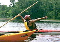 Traditional tools including throwing sticks and practice harpoons. 